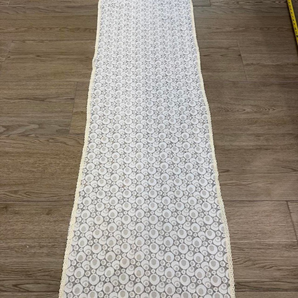 Vintage White lace table runner with repeating circular pattern